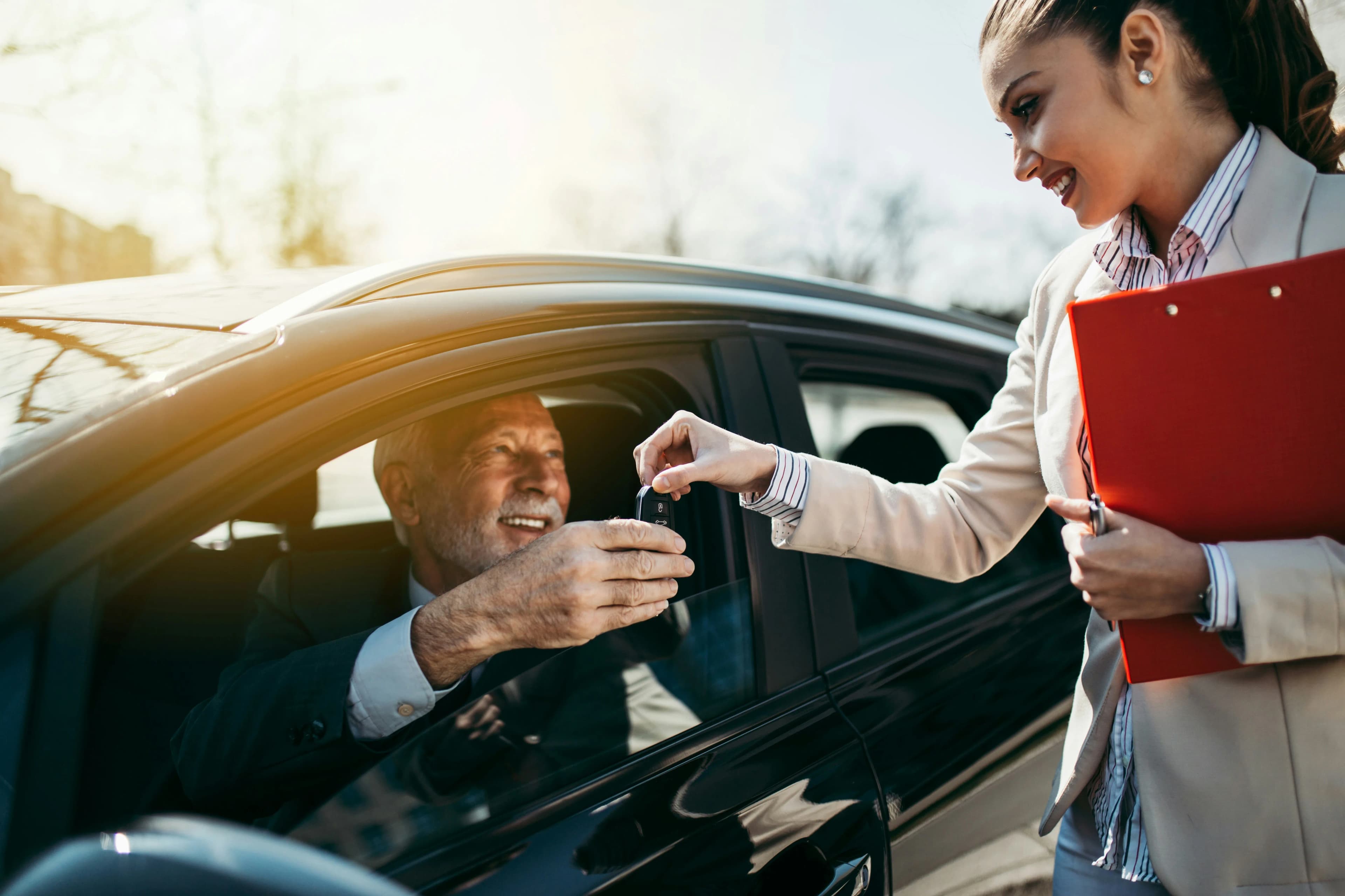 Customer signing for a new vehicle